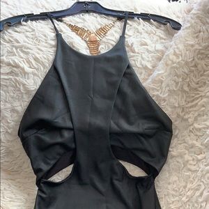 Little black dress with rhinestone attached to the back.